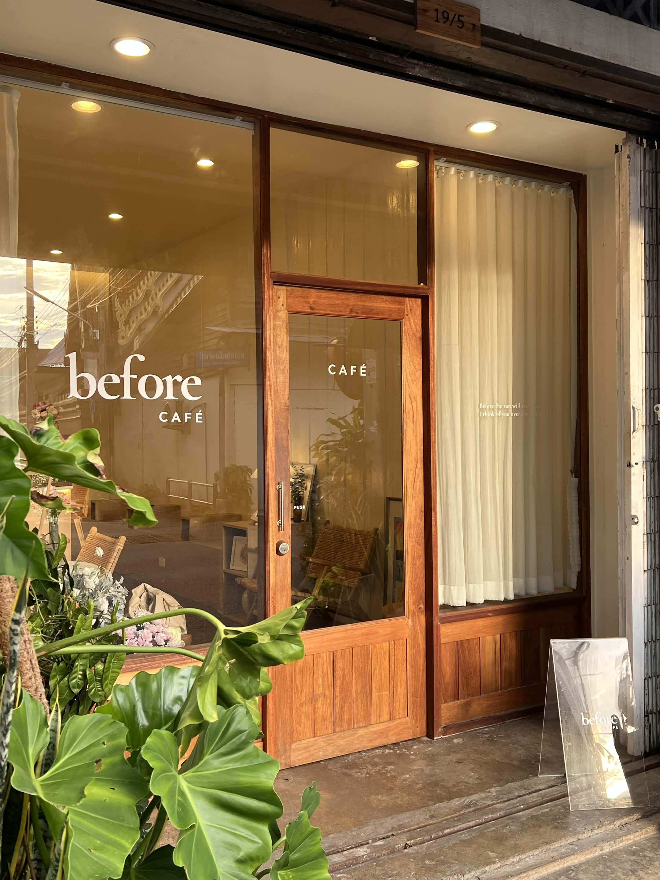 The shopfront of Before Café — wooden door with 'before CAFÉ' lettering on the glass